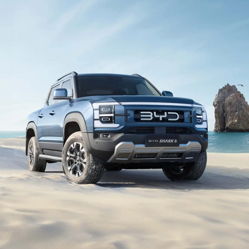 BYD Shark 6 is a mid-size plug-in hybrid pickup truck with dimensions of 5457x1971x1925mm and a 3260mm wheelbase. It has 200–230mm ground clearance, 700mm wading depth, approach angle 31°, departure angle 19.3°, and 6.75m minimum turning radius. The sturdy body-on-frame structure and long wheelbase ensure strong loading capacity, off-road stability and riding comfort for both urban and rural use.